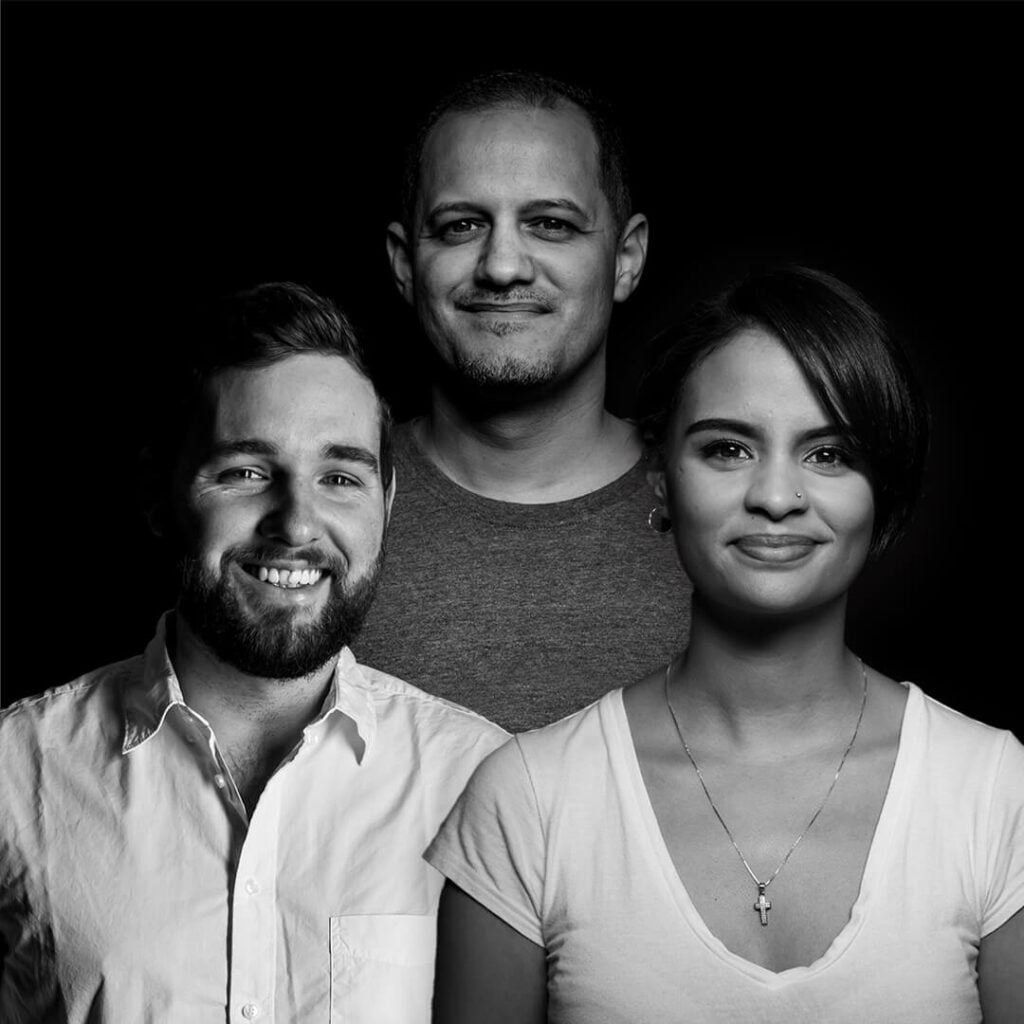 three people smiling